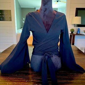 Black halter wrap top.  Trumpet sleeves